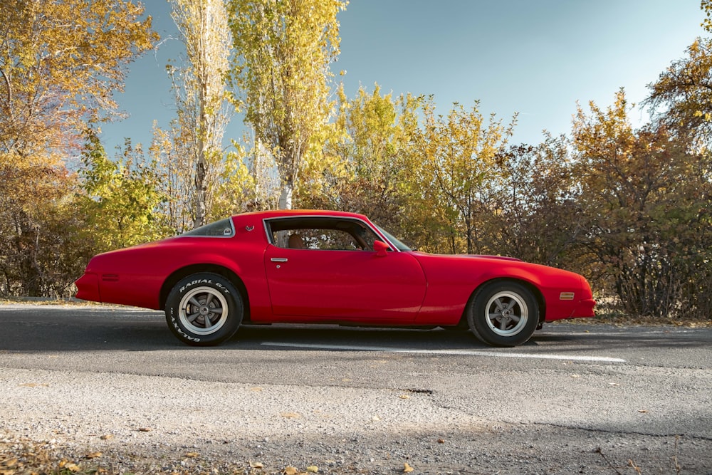 a red car parked on a road