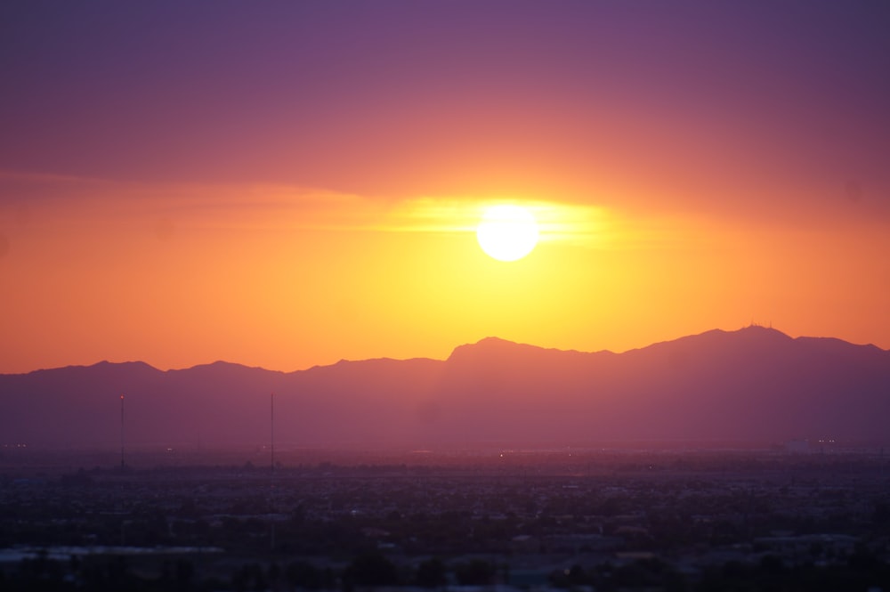 a sunset over a city