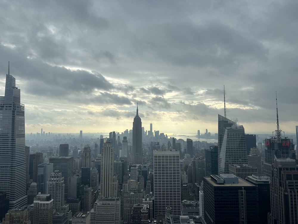 a city skyline with clouds in the sky