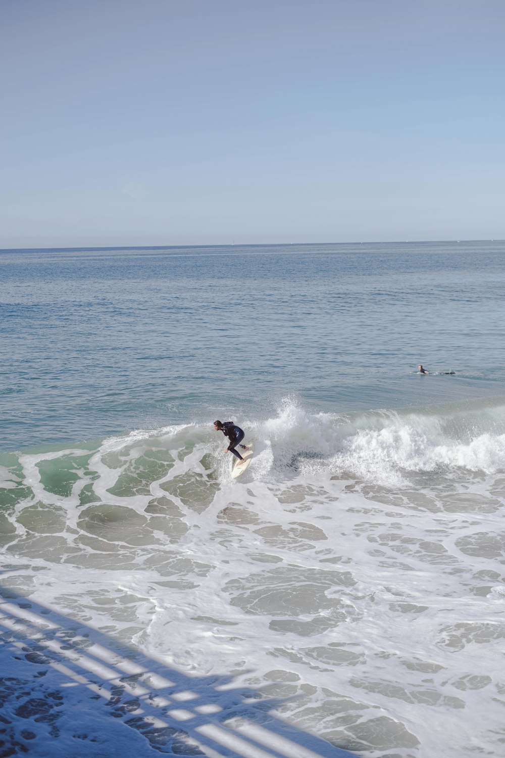 a person surfing on the waves