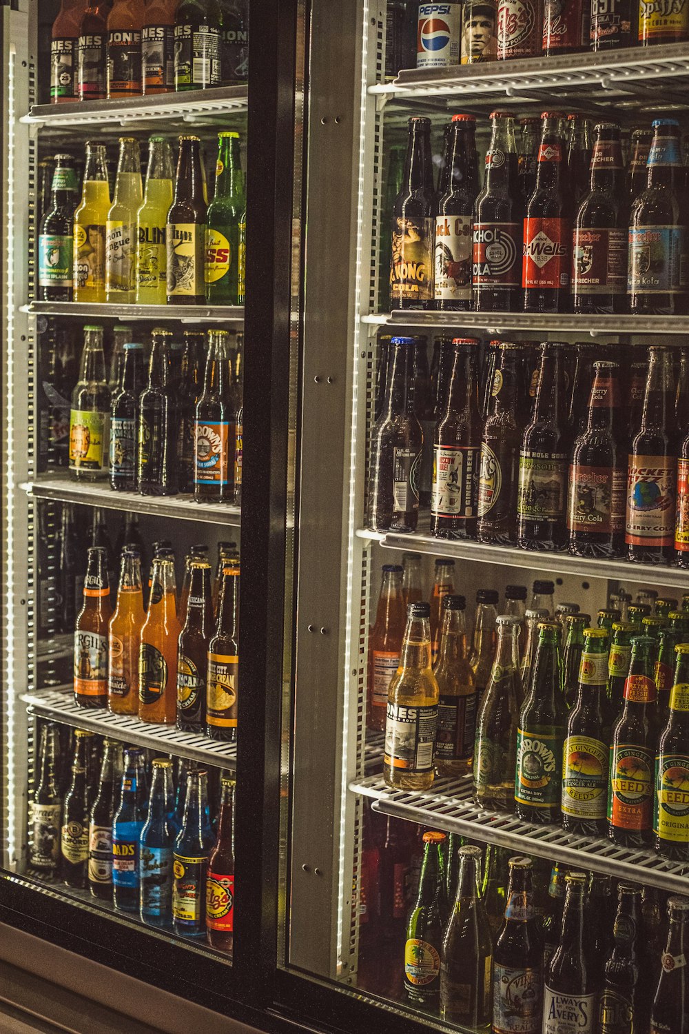 a shelf with bottles of alcohol