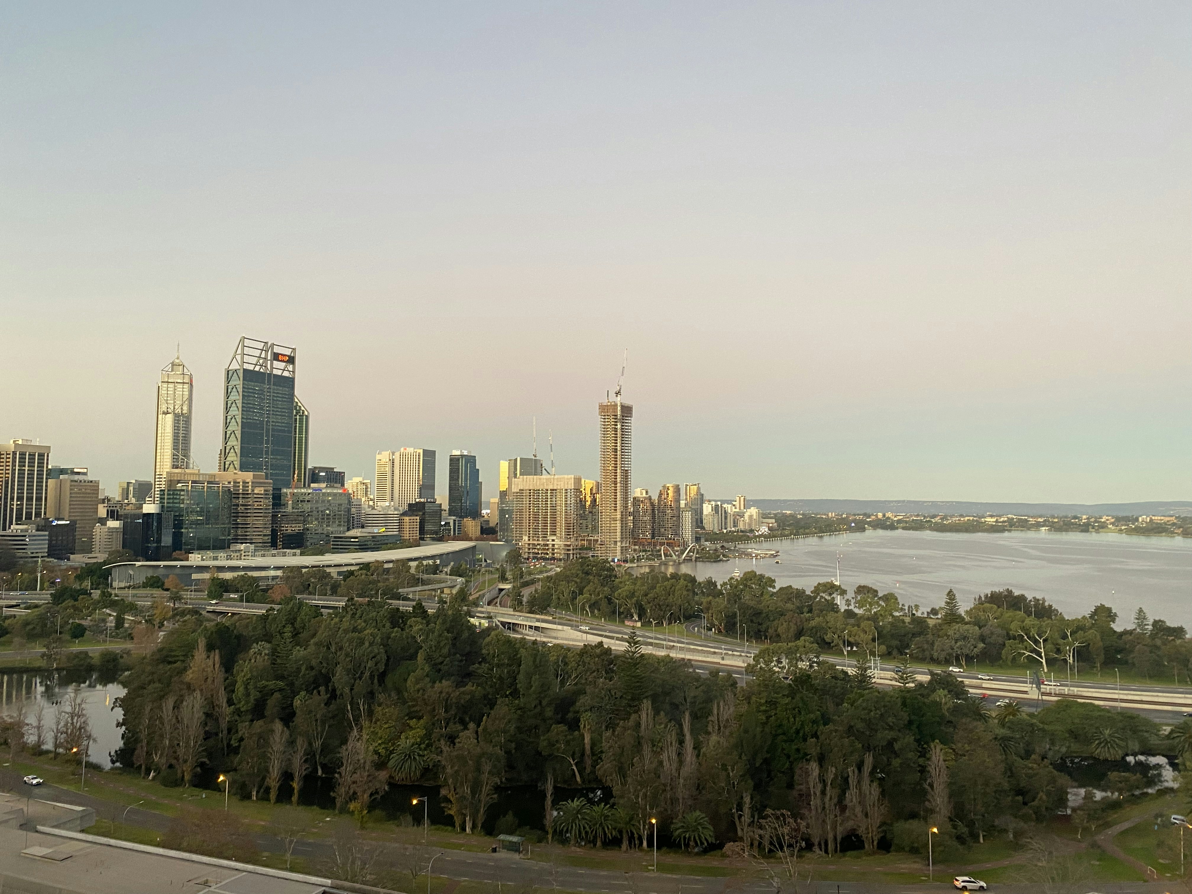 A city with tall buildings and trees photo – Free Urban Image on Unsplash