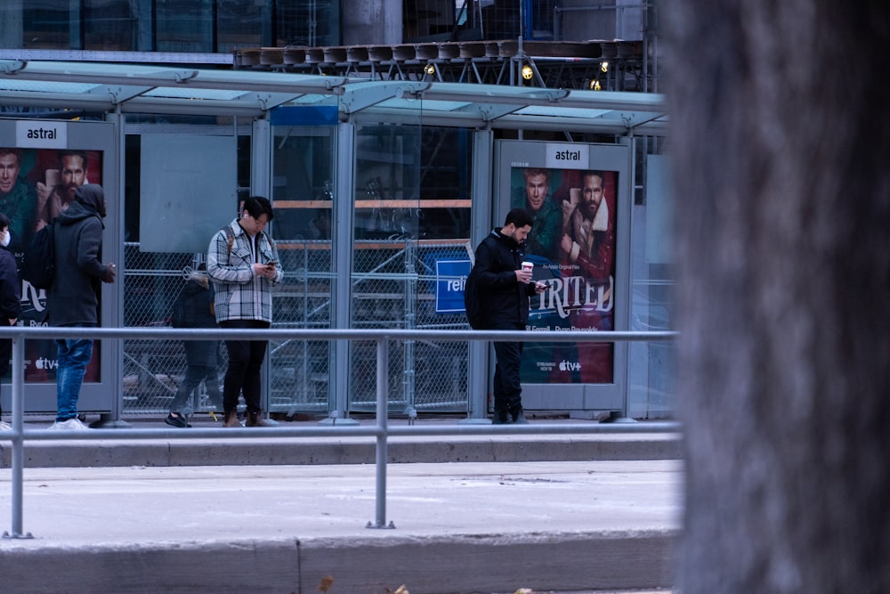 a group of people standing outside a building