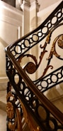 Close-up of a metal railing with intricate design details