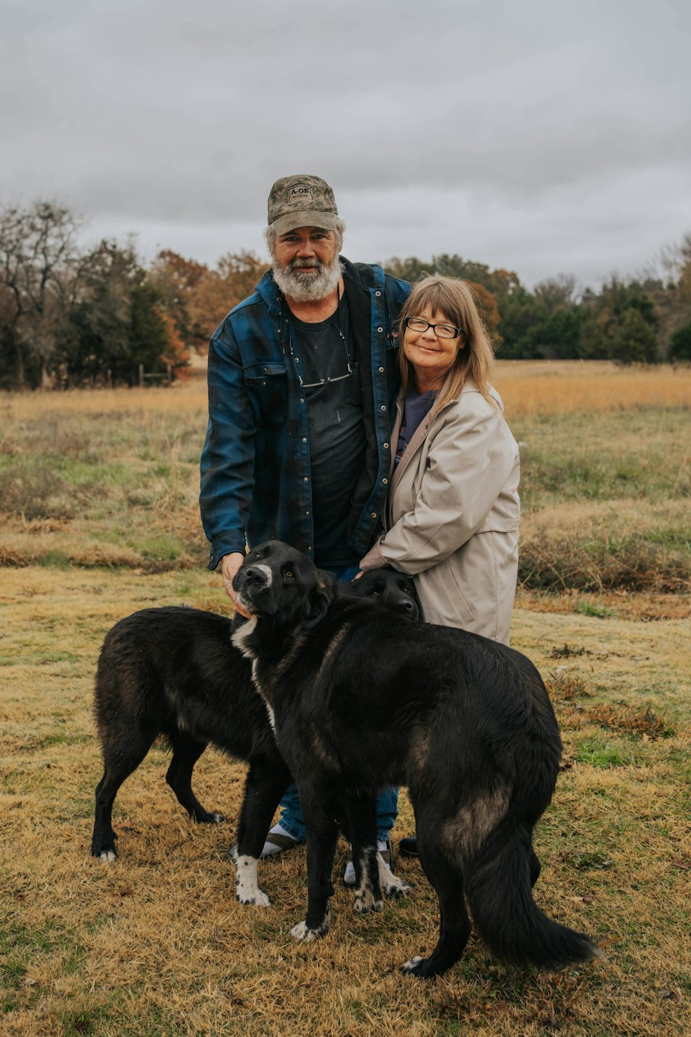 a man and woman with dogs