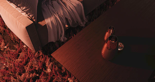 A plush, inviting sofa in a warm living room setting with soft lighting and cozy throws.