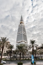 a tall building with trees in front of it