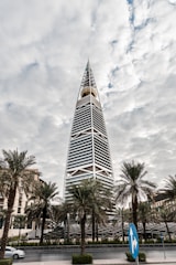 a tall building with trees in front of it