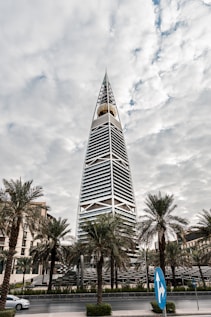 a tall building with trees in front of it