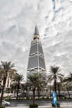 a tall building with trees in front of it