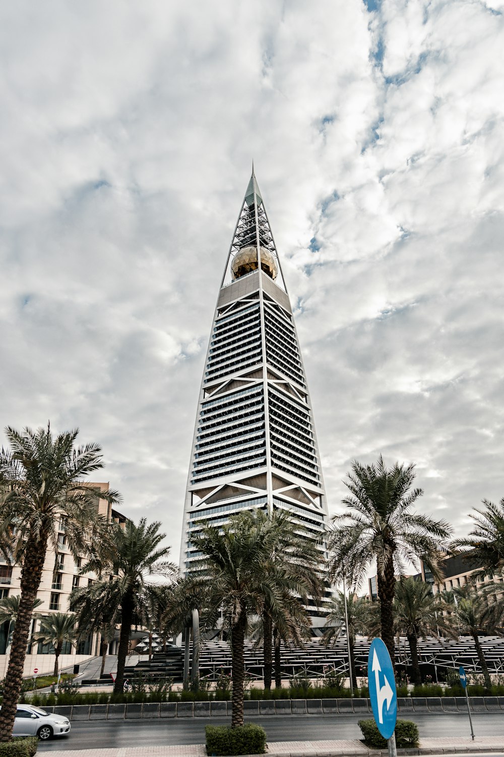 a tall building with trees in front of it