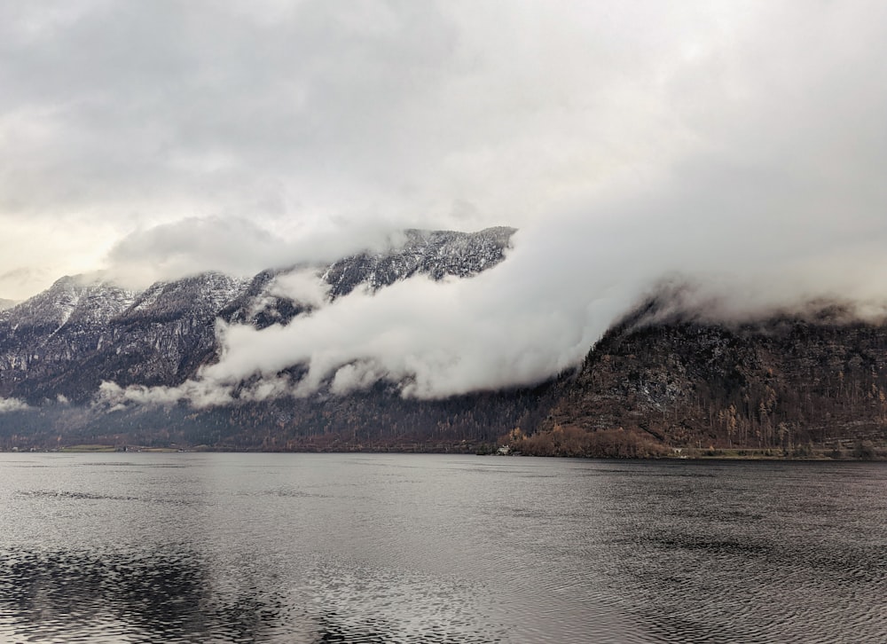 a lake with mountains in the background