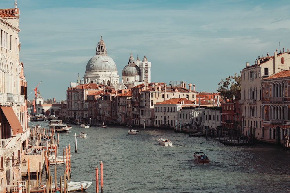 a body of water with boats in it and buildings around it