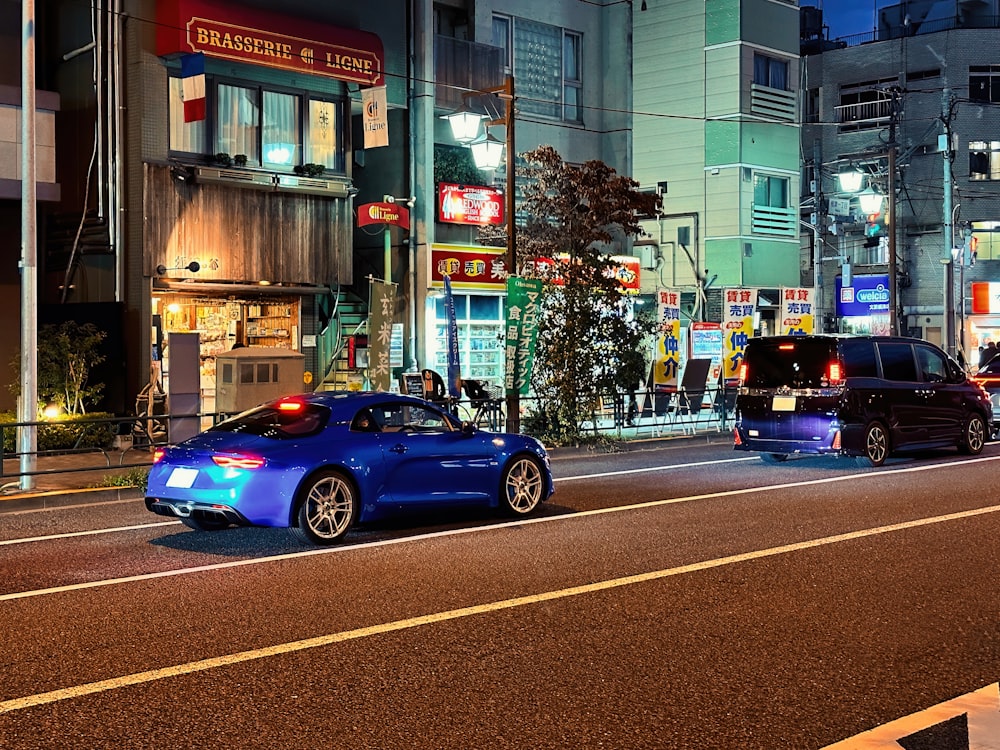 a blue car on the street