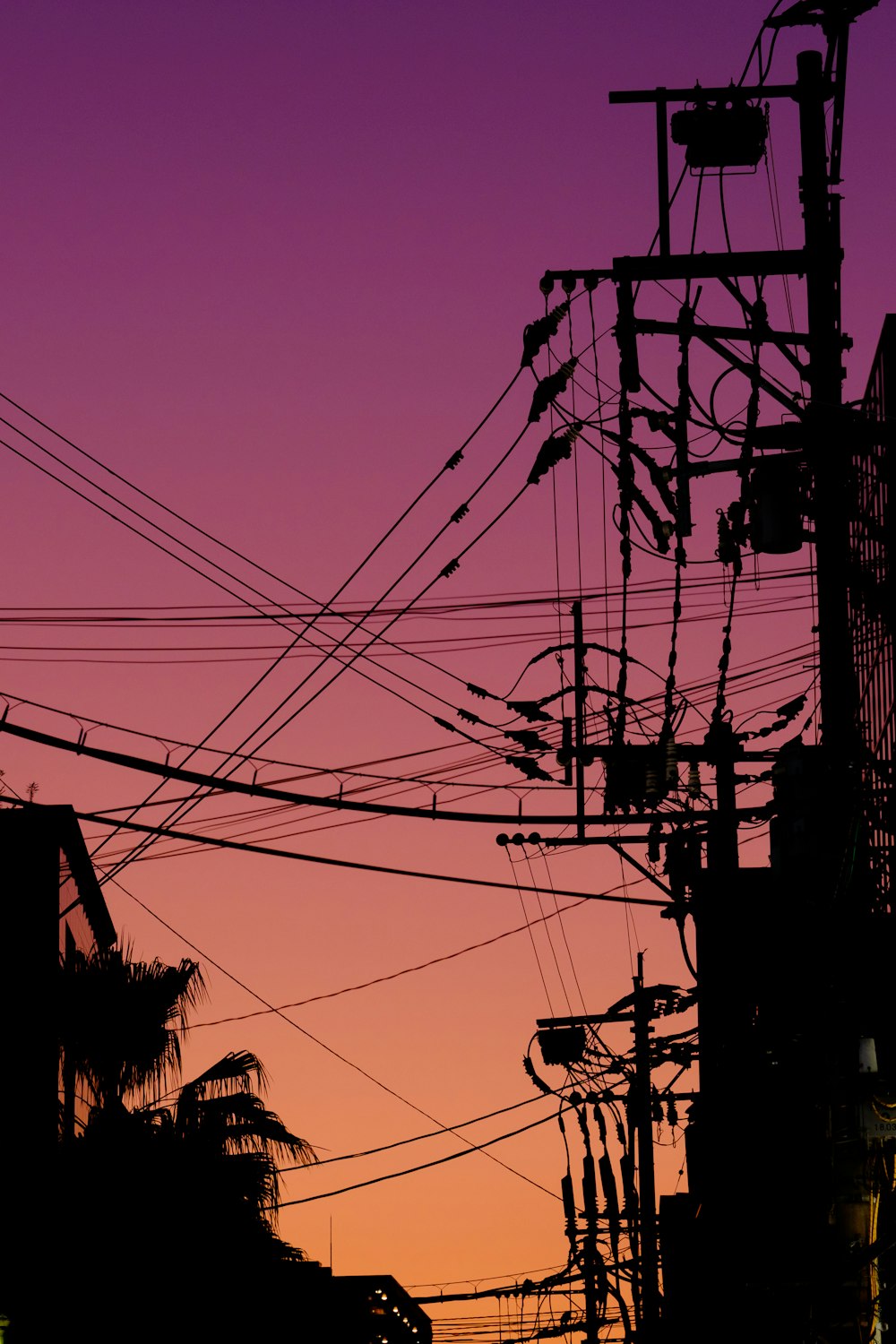 a power line with a purple sky
