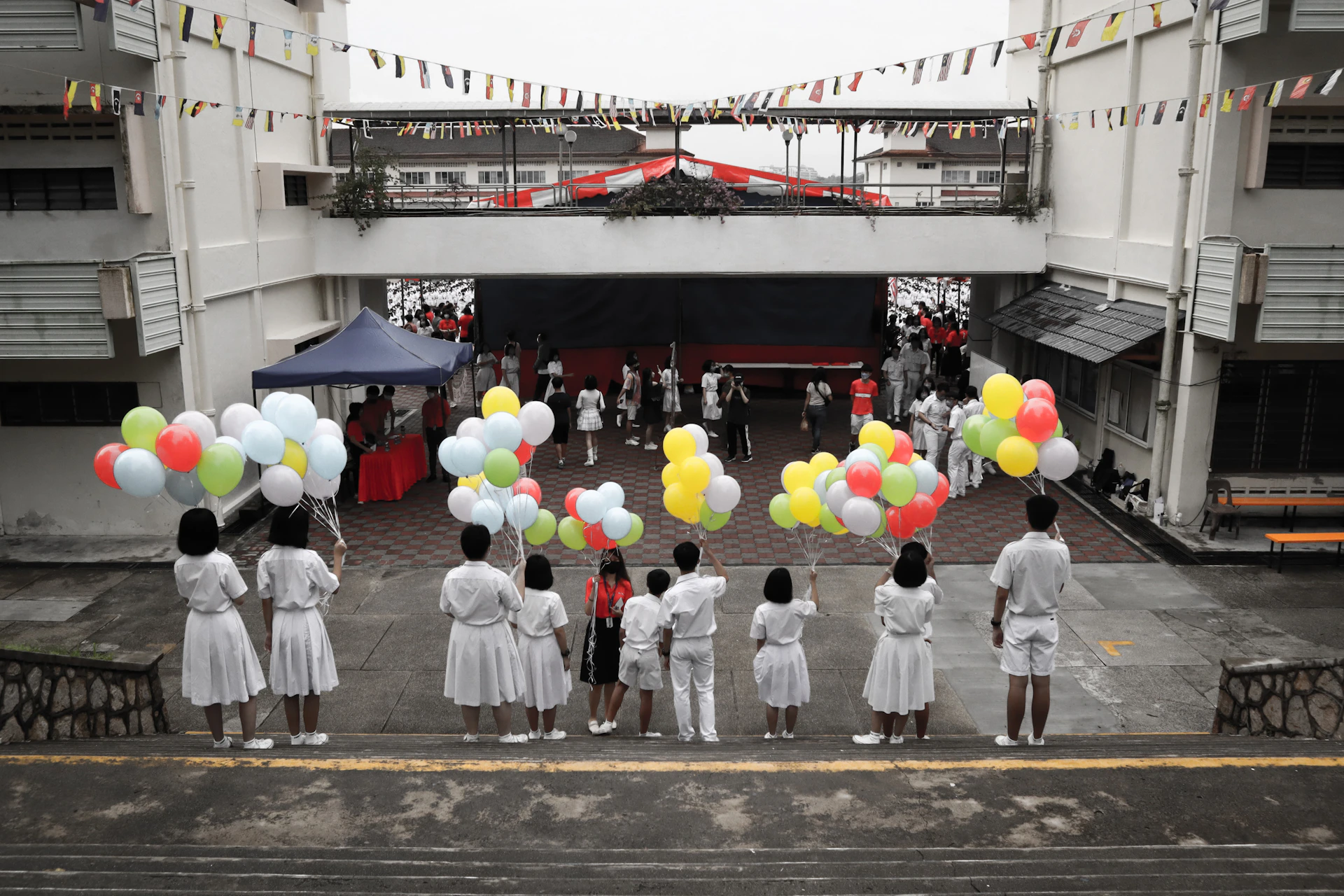 a group of people holding balloons