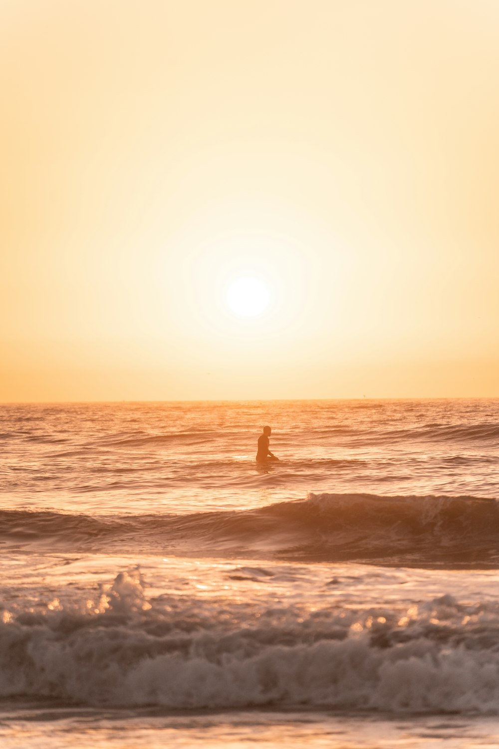 a person surfing in the sea