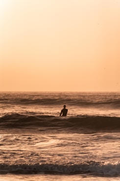 a person surfing in the sea