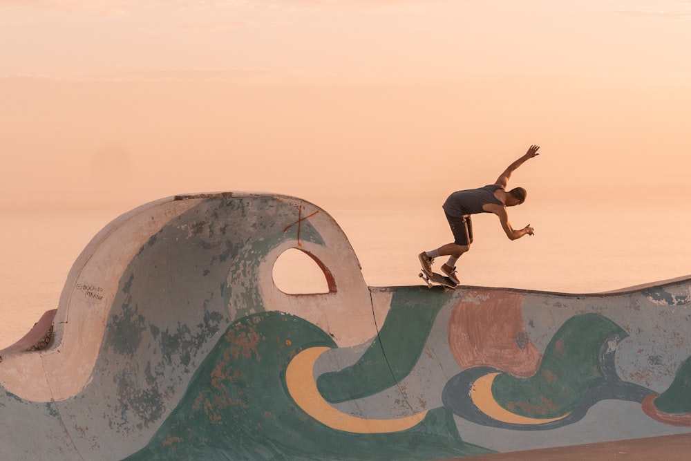 a man riding a skateboard on a ramp