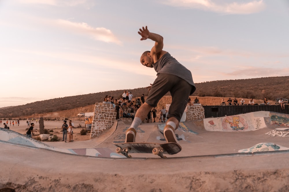 a man riding a skateboard at a skate park