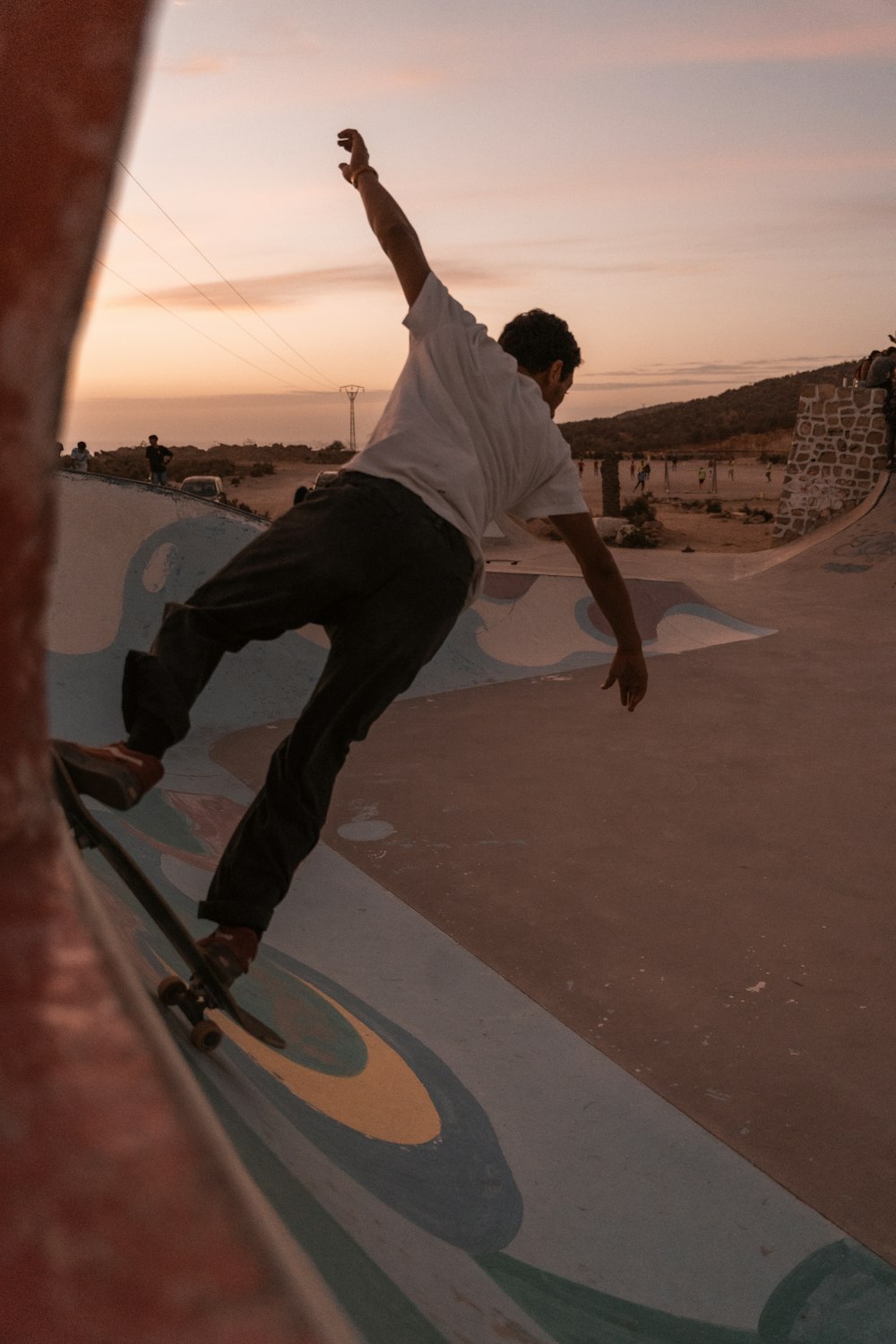 a man riding a skateboard at a skatepark