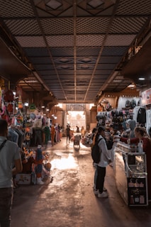 people in a market with Underground Atlanta in the background