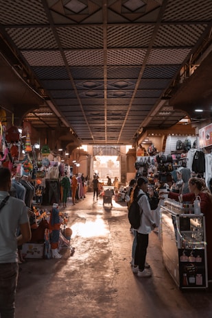 people in a market with Underground Atlanta in the background