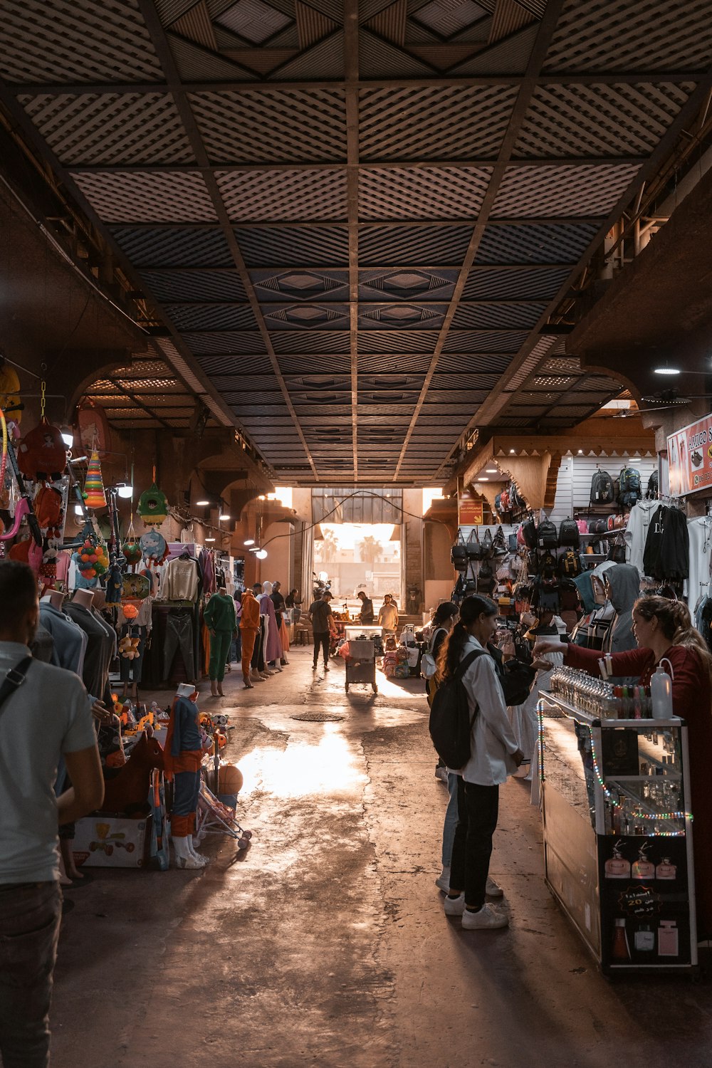 people in a market with Underground Atlanta in the background