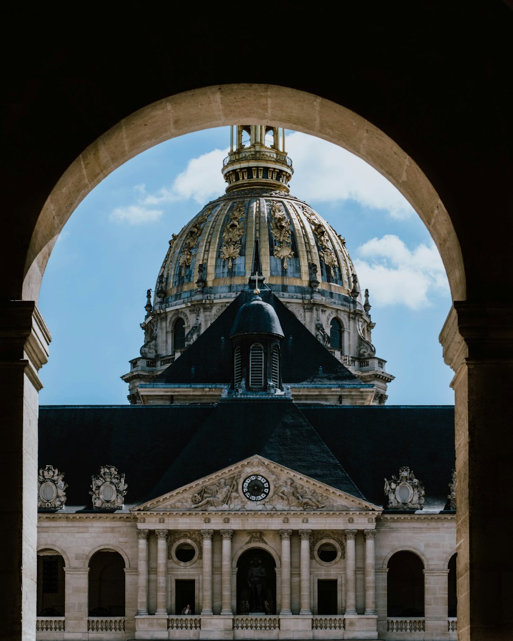 a building with a dome and a cross on top