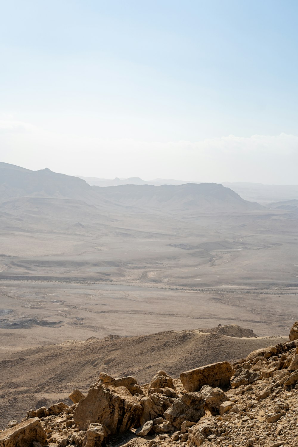 a rocky landscape with hills in the background