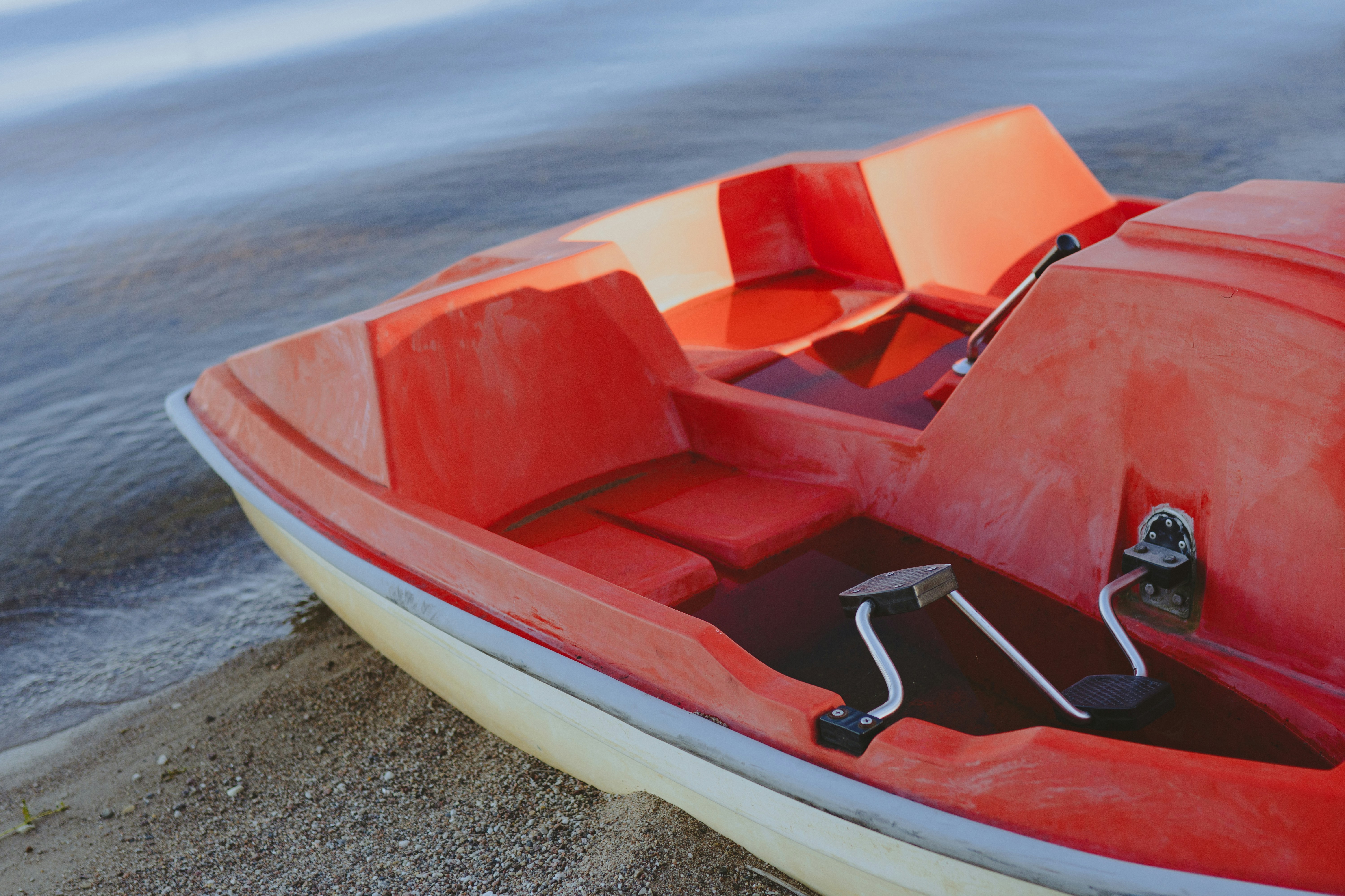 a red boat on the water