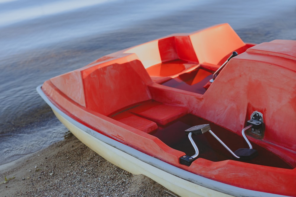 a red boat on the water