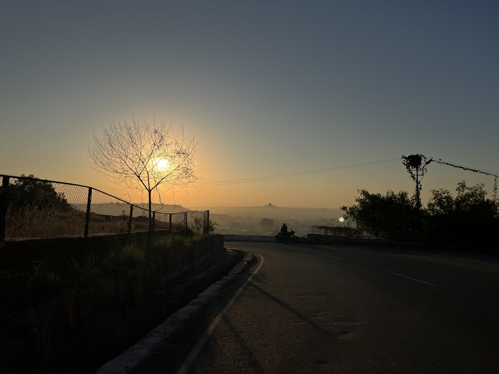 a road with a sunset