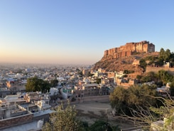a city with a large rock cliff