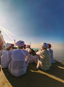 a group of people in white robes