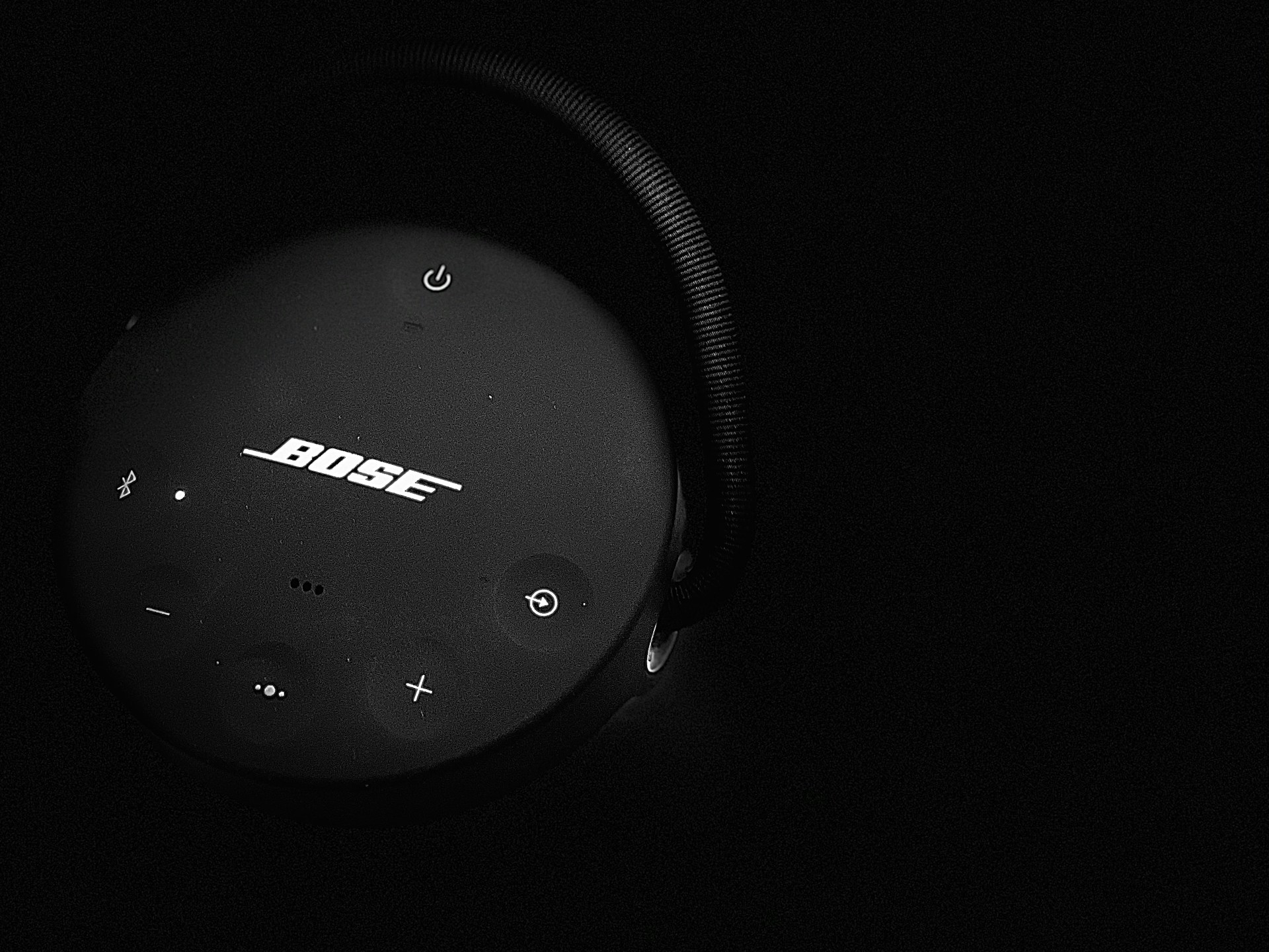 a black headphone with a white screen