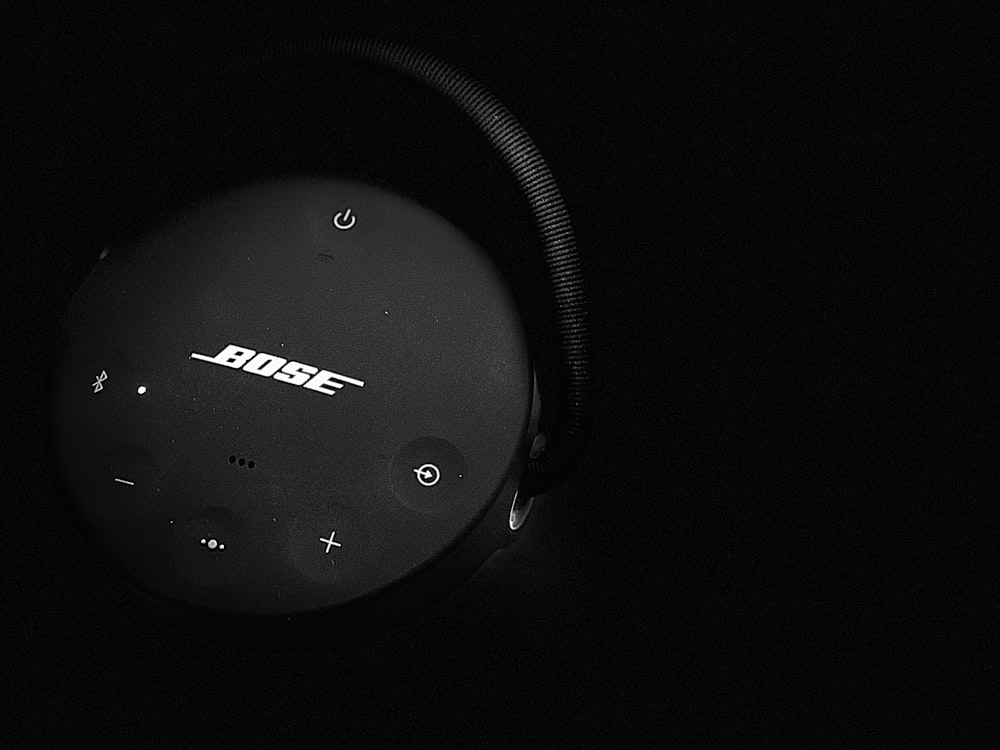 a black headphone with a white screen