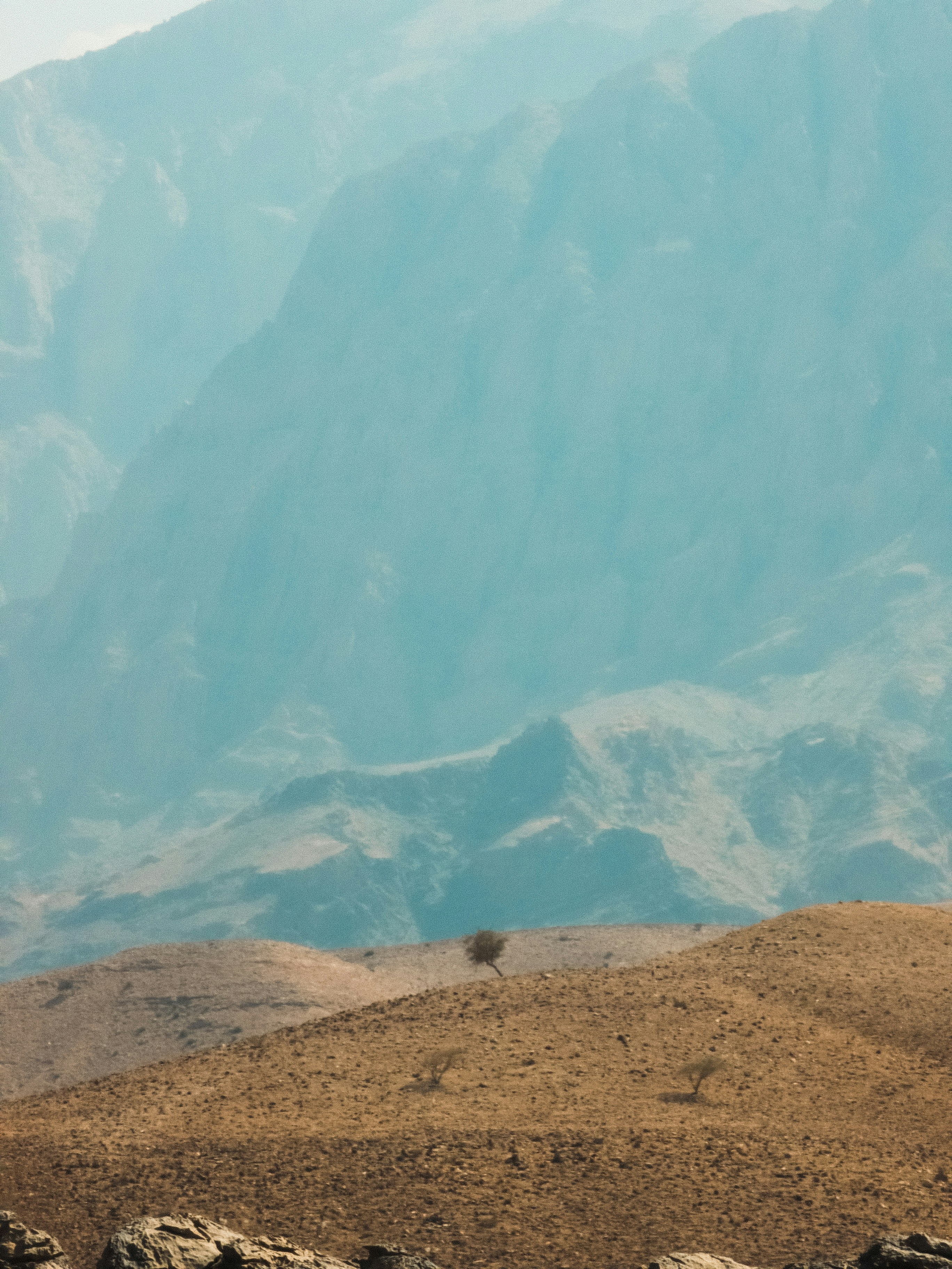 a large mountain with a valley below