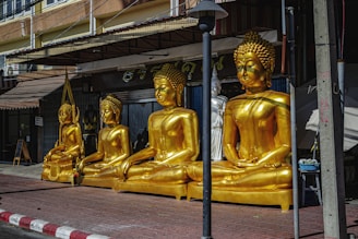 Where to stay in Bangkok: Sukhumvit a group of golden buddha statues