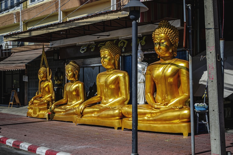 Where to stay in Bangkok: Sukhumvit a group of golden buddha statues