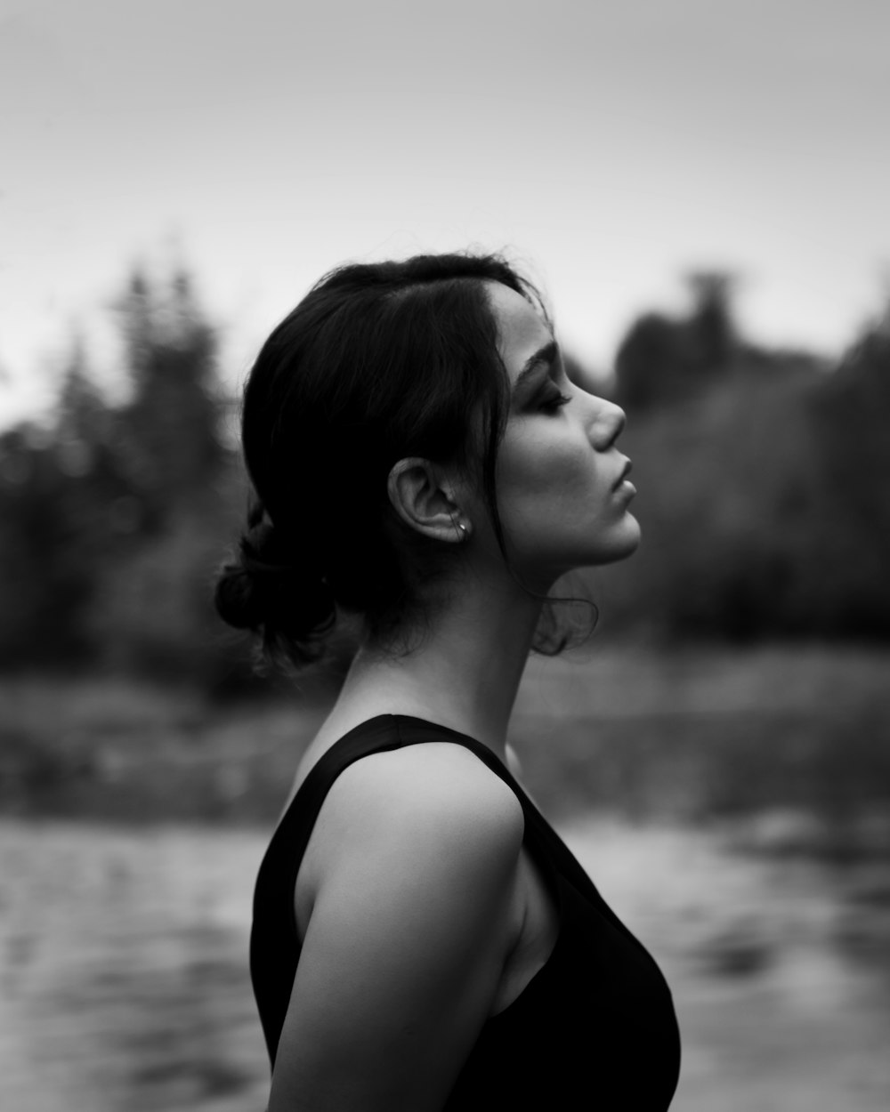 a woman with her hair blowing in the wind