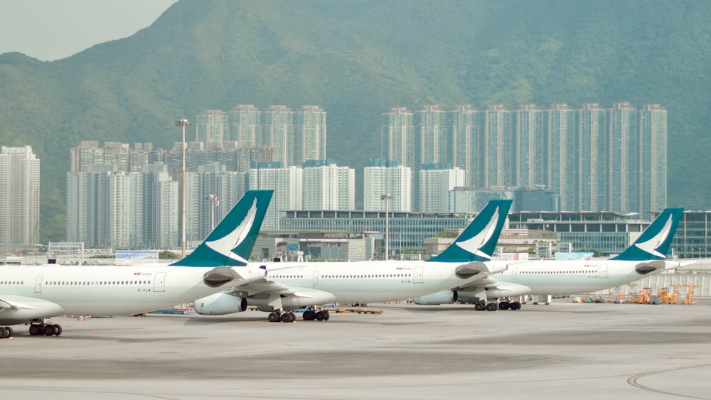 a group of airplanes at an airport