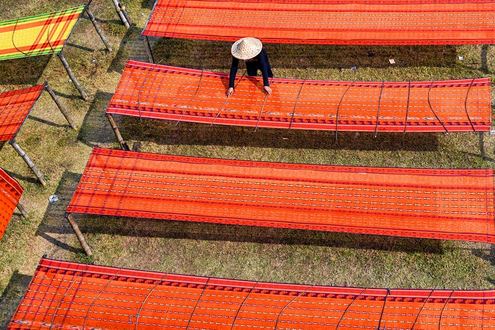 a person walking on a red mat