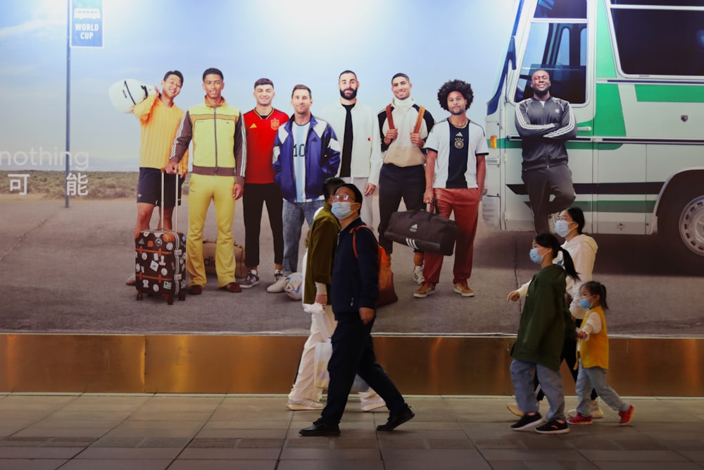 a group of people standing on a runway