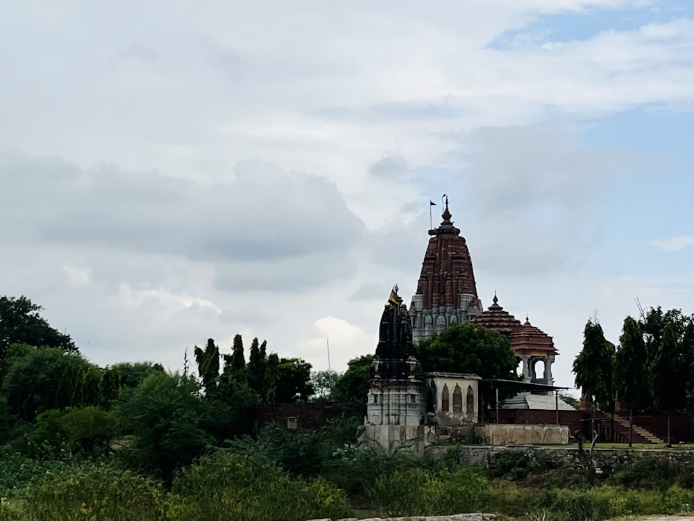 a building with towers surrounded by trees