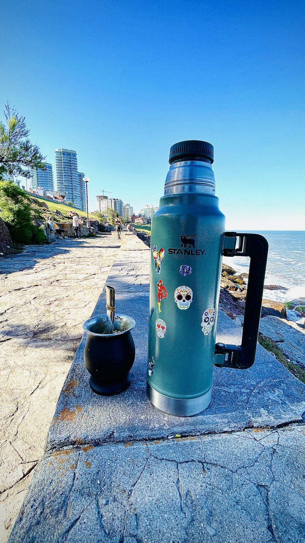 a blue bottle on a stone ledge