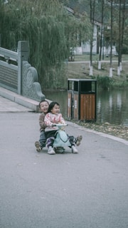 A group of children with special needs happily riding their adaptive tricycles together in a park.