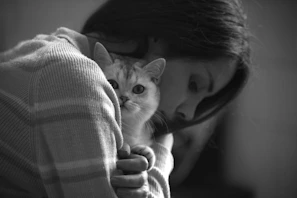 a person holding a cat