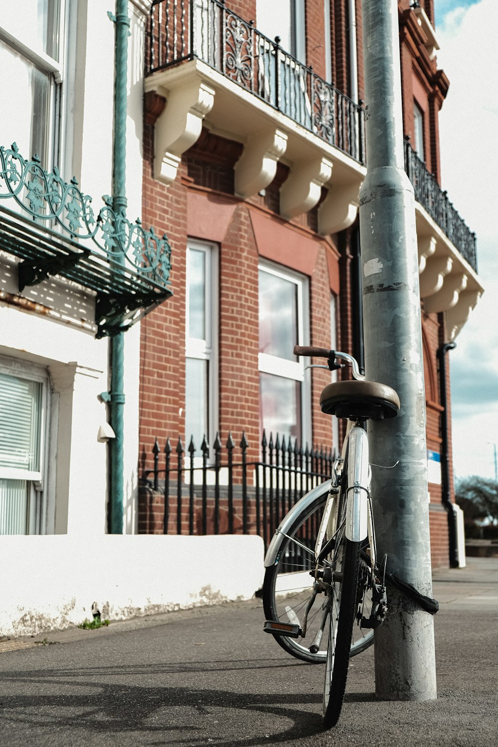 a bicycle is parked on the side of a street