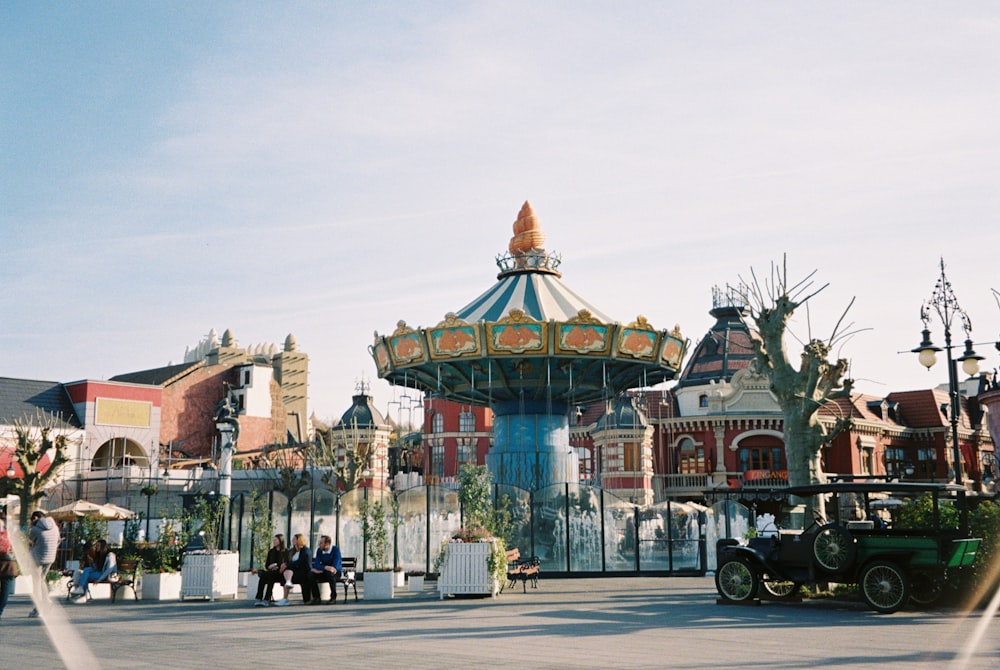 a colorful building with a carousel